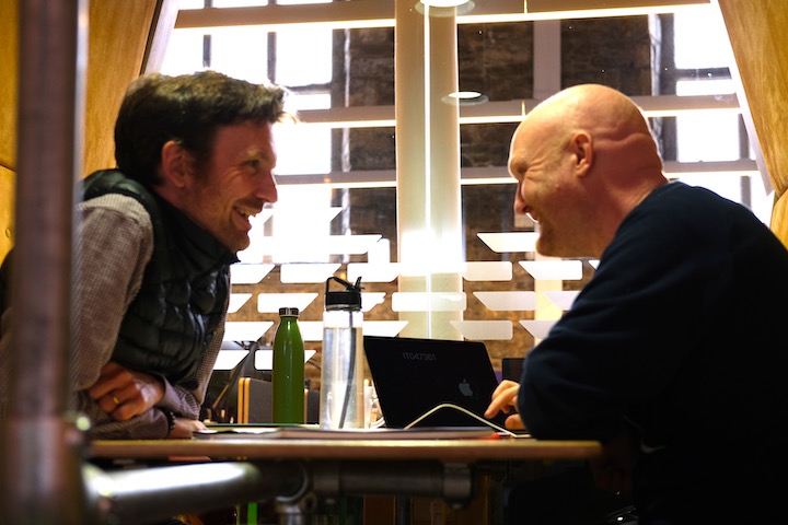 Photo of Oliver Broadbent and James Norman facing each other discussing the development of their book the Regenerative Structural Engineer