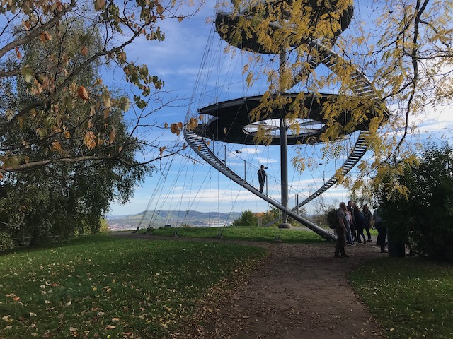 Image showing a double helix stair case rising around a central mast, held in place by a net of cables